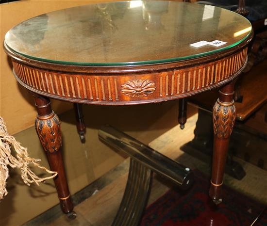 Circular side table with glass top